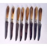 A SET OF ANTIQUE RHINOCEROS HORN HANDLED KNIVES. (qty)