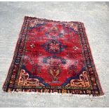 A small Persian rug 154 x 113 cm.