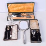 A collection of silver and plated items Egg cup and spoons, mirror etc (5)