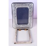 AN EDWARDIAN SILVER PHOTOGRAPH FRAME and another silver frame. 420 grams overall. Largest 23 cm x 18
