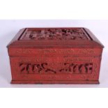 A 19TH CENTURY CHINESE RED LACQUERED RECTANGULAR CASKET Qing, decorated with figures and landscapes.