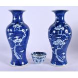 A PAIR OF 19TH CENTURY CHINESE BLUE AND WHITE PORCELAIN PRUNUS VASES Qing, and a Kangxi teabowl. Lar