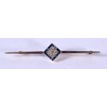 AN ANTIQUE GOLD BAR BROOCH WITH DIAMONDS AND SAPPHIRES SET IN A DIAMOND SHAPE. 7cm x 1.3cm, weight