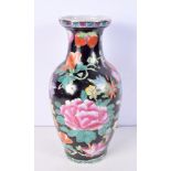 A large Chinese Porcelain Famille Noire vase decorated with flowers 36 x 18 cm.