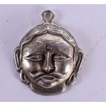 AN UNUSUAL ANTIQUE INDIAN MIDDLE EASTERN SILVER MASK PENDANT. 6.3 grams. 2.75 cm wide.