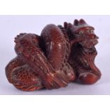 A JAPANESE CARVED BONE DRAGON NETSUKE. 5 cm x 3 cm.