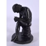A 19TH CENTURY EUROPEAN BRONZE FIGURE OF THE THORN PICKER modelled upon a circular base. 11 cm high.