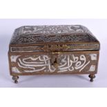 A 19TH CENTURY MIDDLE EASTERN CAIRO WARE BRONZE CASKET silver inlaid with calligraphy and vines. 12