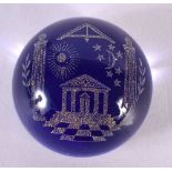 AN UNUSUAL MASONIC BLUE GLASS PAPERWEIGHT. 7.5 cm diameter.