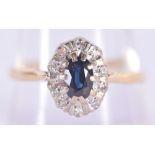 AN 18CT GOLD DIAMOND AND SAPPHIRE RING. 3.1 grams. S.