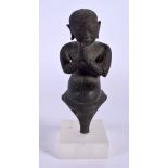 A 17TH/18TH CENTURY SOUTH EAST ASIAN THAI FIGURE OF A BUDDHA modelled with hands clasped. 15 cm high