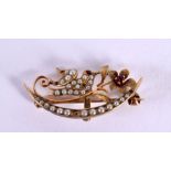 A GOLD SEED PEARL AND RUBY BROOCH. 2 grams. 3 cm x 1.5 cm.