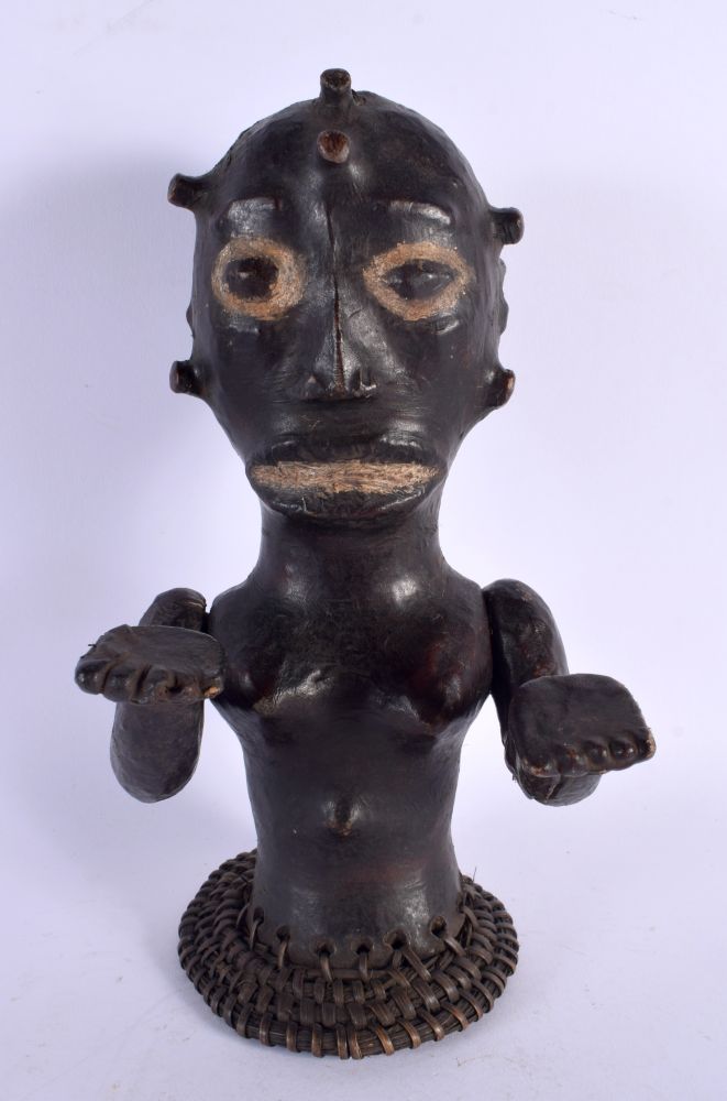 AN EARLY 20TH CENTURY AFRICAN TRIBAL SKIN COVERED FERTILITY FIGURE. 30 cm x 10 cm.