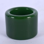 A CHINESE CARVED JADE ARCHERS RING 20th Century. 3.5 cm wide.