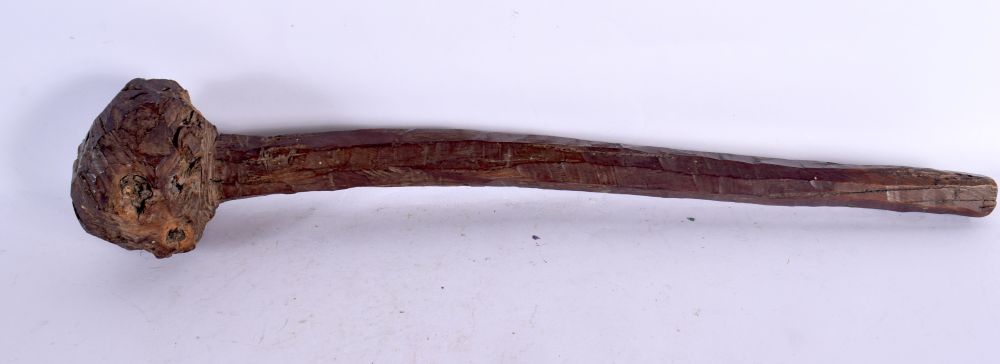 A TRIBAL CARVED WOOD THROWING CLUB. 45 cm long.