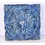 A Chinese blue and white Temple tile decorated with a floral pattern 20 x 20 x 3 cm.