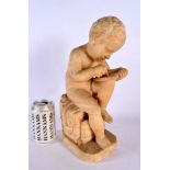 A 19TH CENTURY EUROPEAN CARVED ALABASTER FIGURE OF A BOY modelled scribing. 35 cm high.