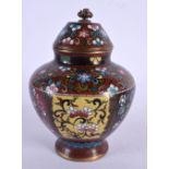 A 19TH CENTURY JAPANESE MEIJI PERIOD CLOISONNE ENAMEL JAR AND COVER decorated with foliage and vines