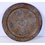 An Islamic copper and white metal dish 30 cm .