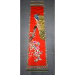 A LATE 19TH CENTURY JAPANESE MEIJI PERIOD RED SILK WORK SCROLL depicting a bird of paradise. 232 cm