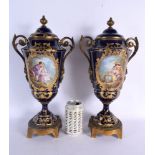 A LARGE PAIR OF 19TH CENTURY FRENCH SEVRES PORCELAIN VASES AND COVERS painted with figures in landsc