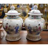 A LARGE PAIR OF CHINESE REPUBLICAN PERIOD FAMILLE ROSE VASES AND COVERS. 27 cm x 18 cm.