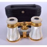A CASED PAIR OF MOTHER-OF-PEARL OPERA GLASSES BY NEGRETTI & ZAMBRA. 5.8cm retracted, 7.5cm extended
