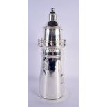 A LARGE SILVER PLATED LIGHTHOUSE COCKTAIL SHAKER. 35 cm high.