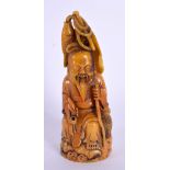 AN EARLY 20TH CENTURY CHINESE CARVED ORANGE STONE FIGURE OF A FISHERMAN Late Qing/Republic. 14.5 cm