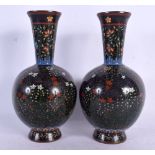 A FINE PAIR OF 19TH CENTURY JAPANESE MEIJI PERIOD CLOISONNE ENAMEL VASES decorated with foliage on a