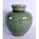 AN EARLY 20TH CENTURY CHINESE KOREAN CELADON INCISED JAR decorated with birds and flowers. 18 cm x 1