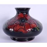 A MOORCROFT SQUAT VASE. 10 cm wide.