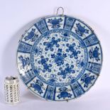 A LARGE 18TH CENTURY DUTCH DELFT BLUE AND WHITE TIN GLAZED CHARGER painted with foliage. 35 cm diame