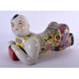 A CHINESE REPUBLICAN PERIOD FAMILLE ROSE PORCELAIN FIGURAL PILLOW. 25 cm x 12 cm.