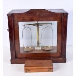 A cased set of Dutch Becker and sons brass balance scales together with a boxed set of weights 40 x