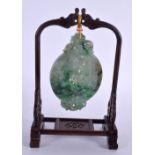 AN EARLY 20TH CENTURY CHINESE CARVED GREEN JADEITE HANGING PANEL Late Qing/Republic, upon a later st