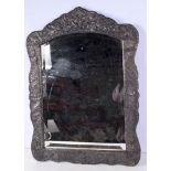 A middle eastern Silver coated floral patterned wooden mirror with bevelled glass 74 x 53 cm