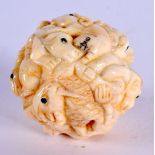 A JAPANESE CARVED BONE ZODIAC BALL. 3.25 cm wide.