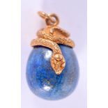 A CONTINENTAL SILVER GILT AND LAPIS LAZULI EGG. 14 grams. 3 cm long.