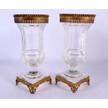 A PAIR OF LATE 19TH CENTURY FRENCH GILT METAL MOUNTED CRYSTAL GLASS URNS. 19 cm high.