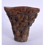 A CHINESE CARVED BUFFALO HORN TYPE LIBATION CUP 20th Century. 814 grams. 14 cm x 12 cm.