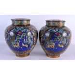 A PAIR OF 19TH CENTURY CHINESE CLOISONNE ENAMEL GINGER JARS AND COVERS decorated with birds and spot