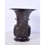 A Japanese bronze vase decorated in panels with subjects engaged in various pursuits 15 cm.