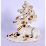 AN UNUSUAL 18TH CENTURY DERBY WHITE GLAZED FIGURE OF A DEER modelled in front of foliage. 12 cm x 8