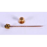 A VICTORIAN 15CT GOLD NUGGET STICK PIN and a stud. 3.6 grams. Largest 2 cm long. (2)