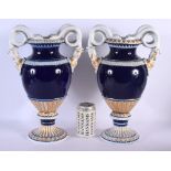 A LARGE PAIR OF GERMAN MEISSEN PORCELAIN TWIN HANDLED VASES. 40 cm x 24 cm.