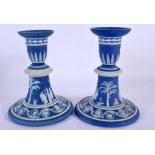 A PAIR OF WEDGWOOD BLUE BASALT CANDLESTICKS. 14.5 cm high.