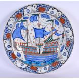 A TURKISH ISLAMIC FAIENCE DISH painted with boats. 32 cm diameter.
