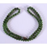 A CHINESE JADE NECKLACE. 28 grams. 52 cm long.