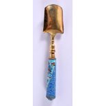 A CONTINENTAL SILVER GILT AND ENAMEL SPOON. 77 grams. 16.5 cm x 3.5 cm.